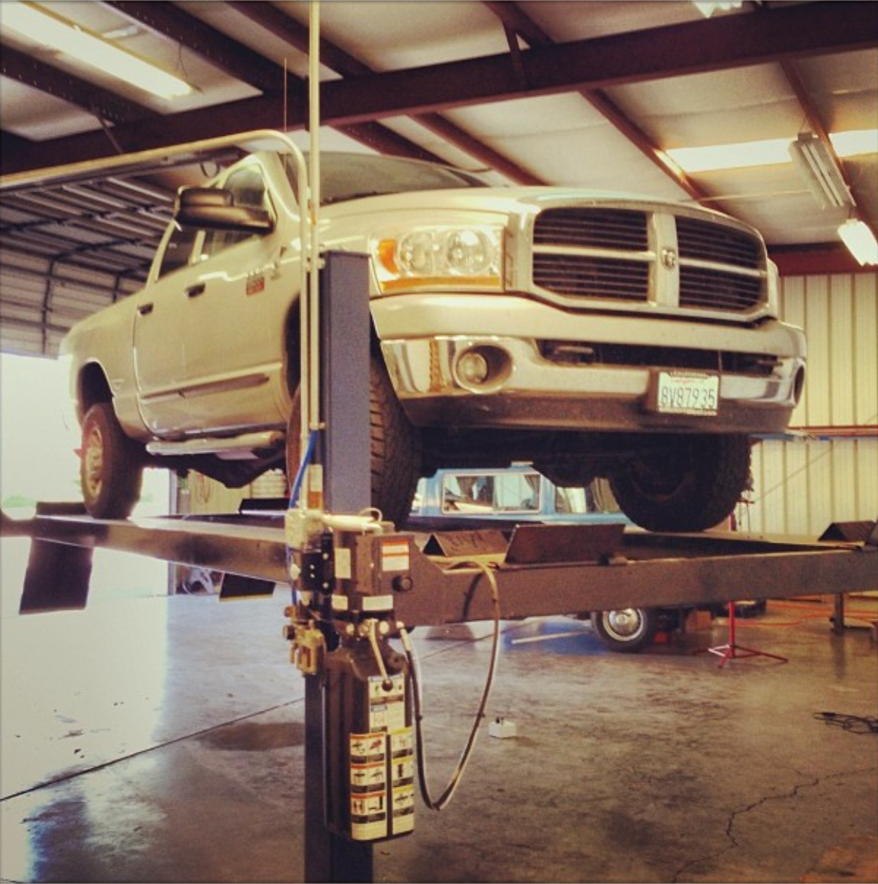 Diesel truck on lift inside VFI drive-in repair facility