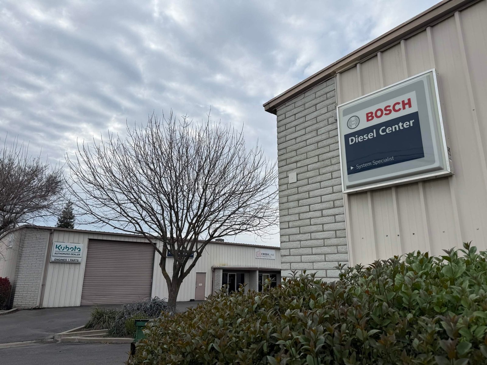 VFI shop exterior showing Bosch Diesel Center and Kubota dealer signage