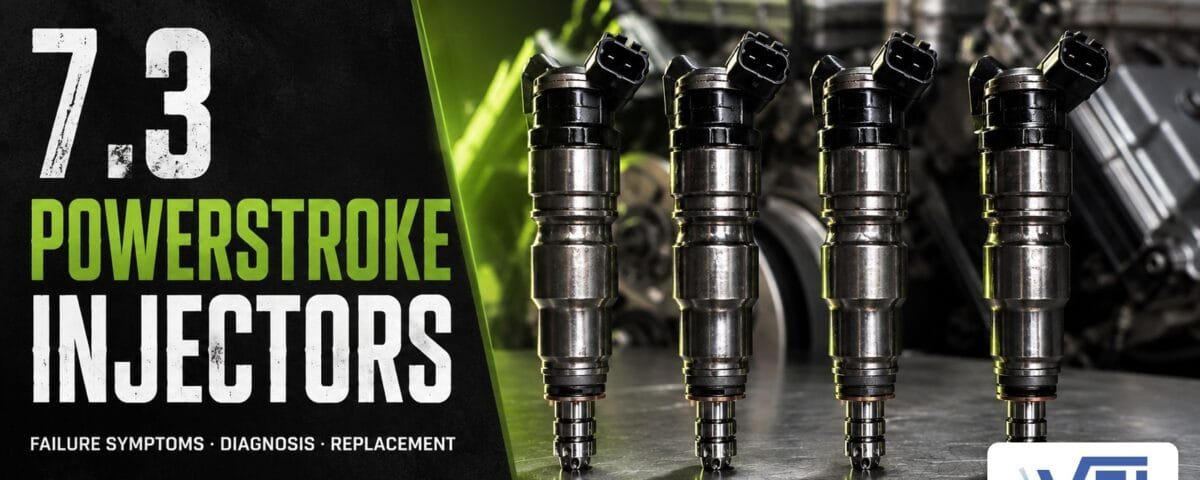 7.3L Power Stroke HEUI diesel fuel injectors on a workbench — Valley Fuel Injection