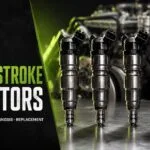 7.3L Power Stroke HEUI diesel fuel injectors on a workbench — Valley Fuel Injection