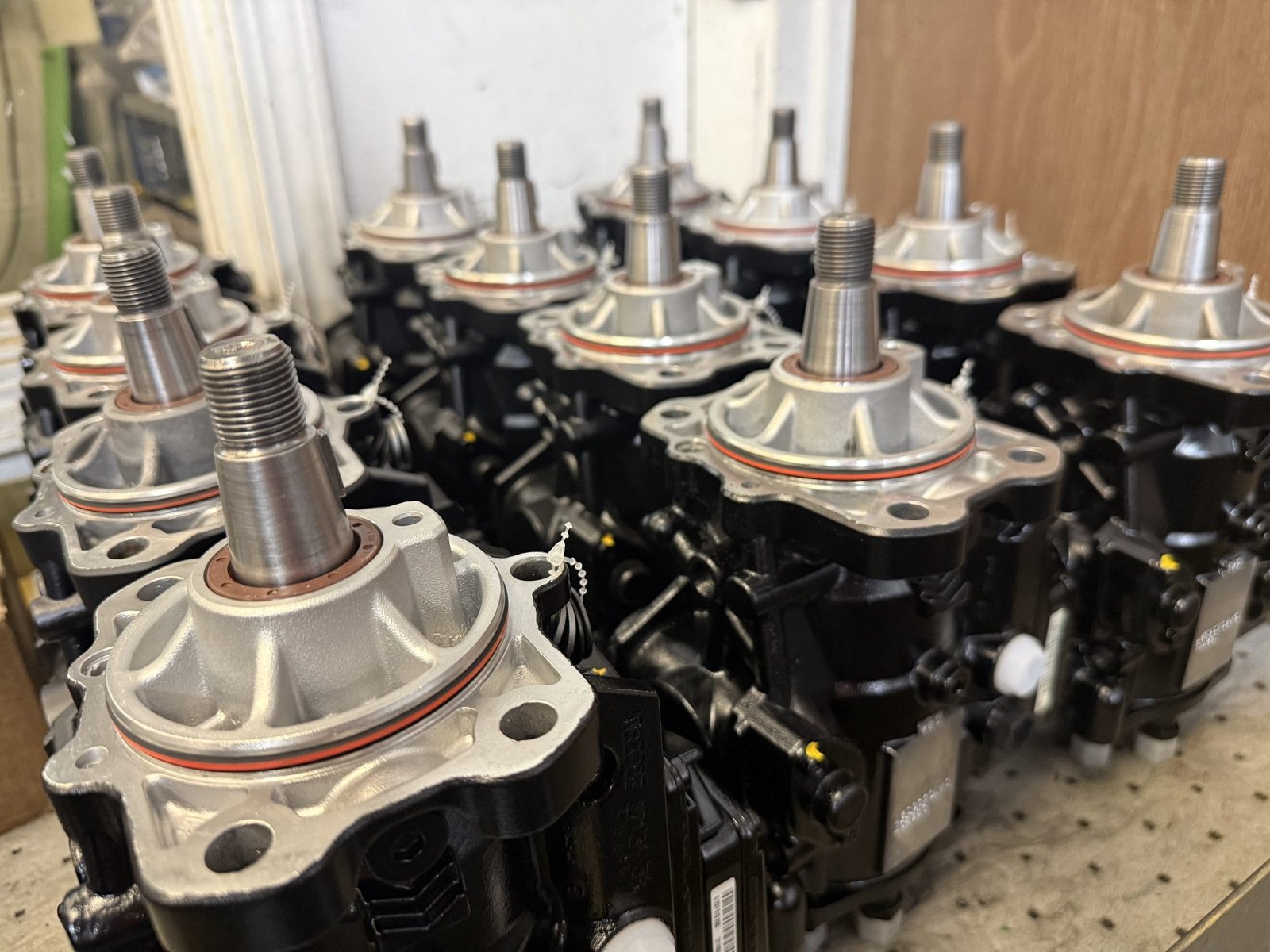 Close-up row of freshly remanufactured Bosch VP44 injection pumps with new drive shafts and seals at Valley Fuel Injection.